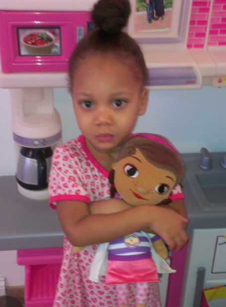 Ava with her favorite toy, "Doc McStuffins." She sleeps with her every night!