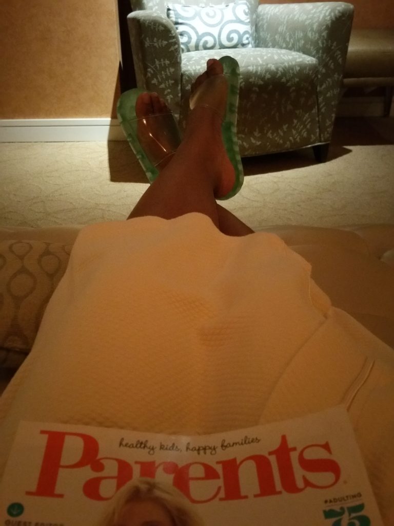 Relaxing and reading before my massage at Mount Airy Casino Resort.