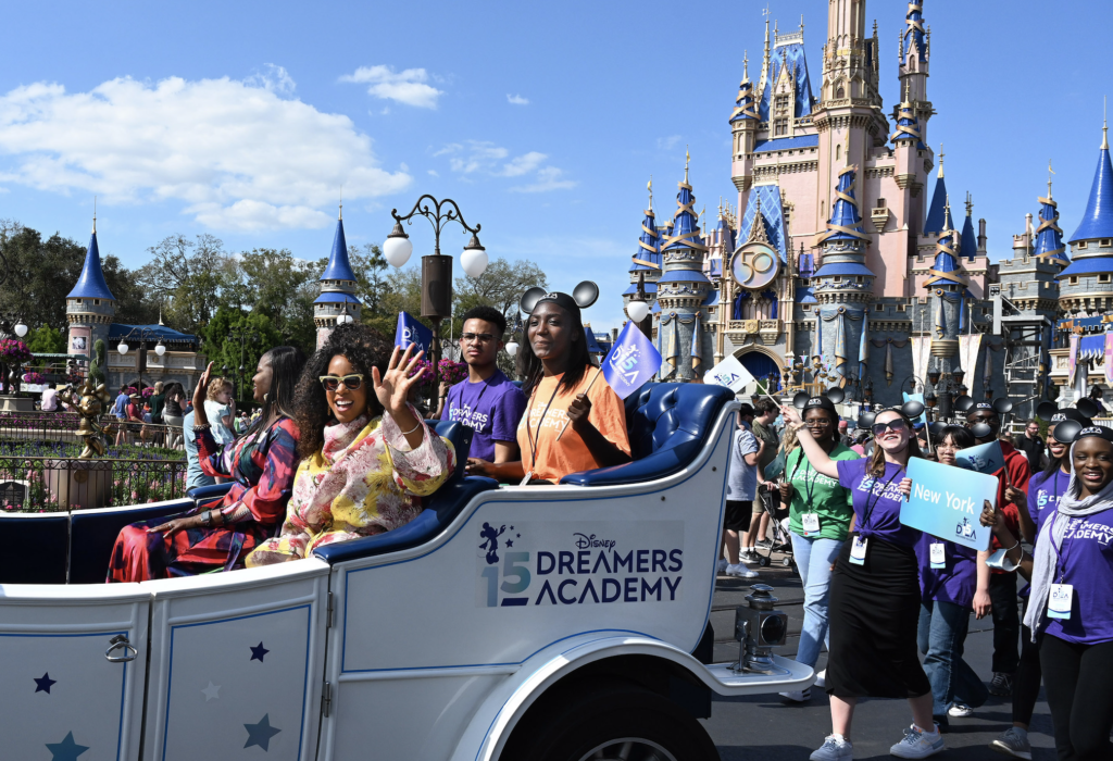 Grammy Award-winning singer, songwriter, actress and executive producer Kelly Rowland rides along with several Disney Dreamers during a celebratory parade at Magic Kingdom during the landmark 15th year of Disney Dreamers Academy at Walt Disney World Resort in Lake Buena Vista, Fla. The Disney Dreamers Academy, taking place March 3-6, 2022 is a mentorship event hosted annually by Walt Disney World Resort that fosters the dreams of Black students and teens from underrepresented communities. (PHOTO: Todd 