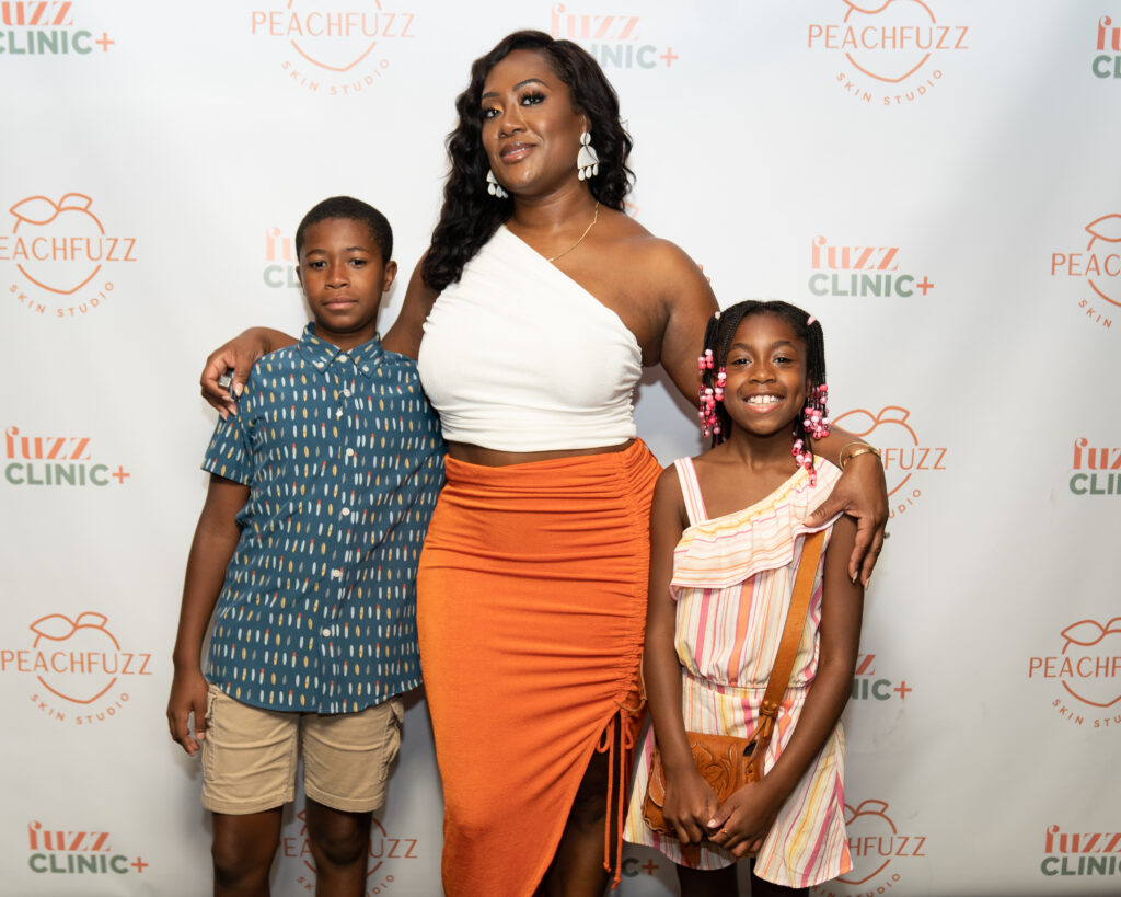 Keisha Wagner-Gaymon with her two children at the PeachFuzz/FuzzClinic launch party in Brooklyn. Photo: Crooks Lane Media