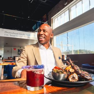 A person sitting at a table with food on it